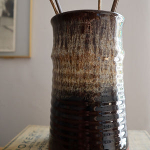 close up of ribbed fat lava drip glaze vase in browns and creams. Available from Bramble and Fox cosy handmade and vintage homeware shop based in Leek, Staffordshire uk