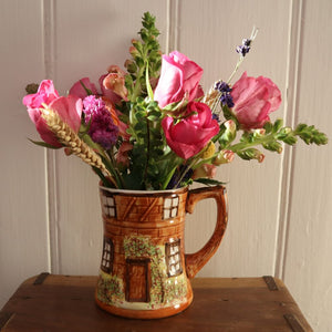 alt="Price Kensington cottageware mug filled with colourful cottage garden flowers against white shiplap background. Available from Bramble and Fox UK hygge shop"