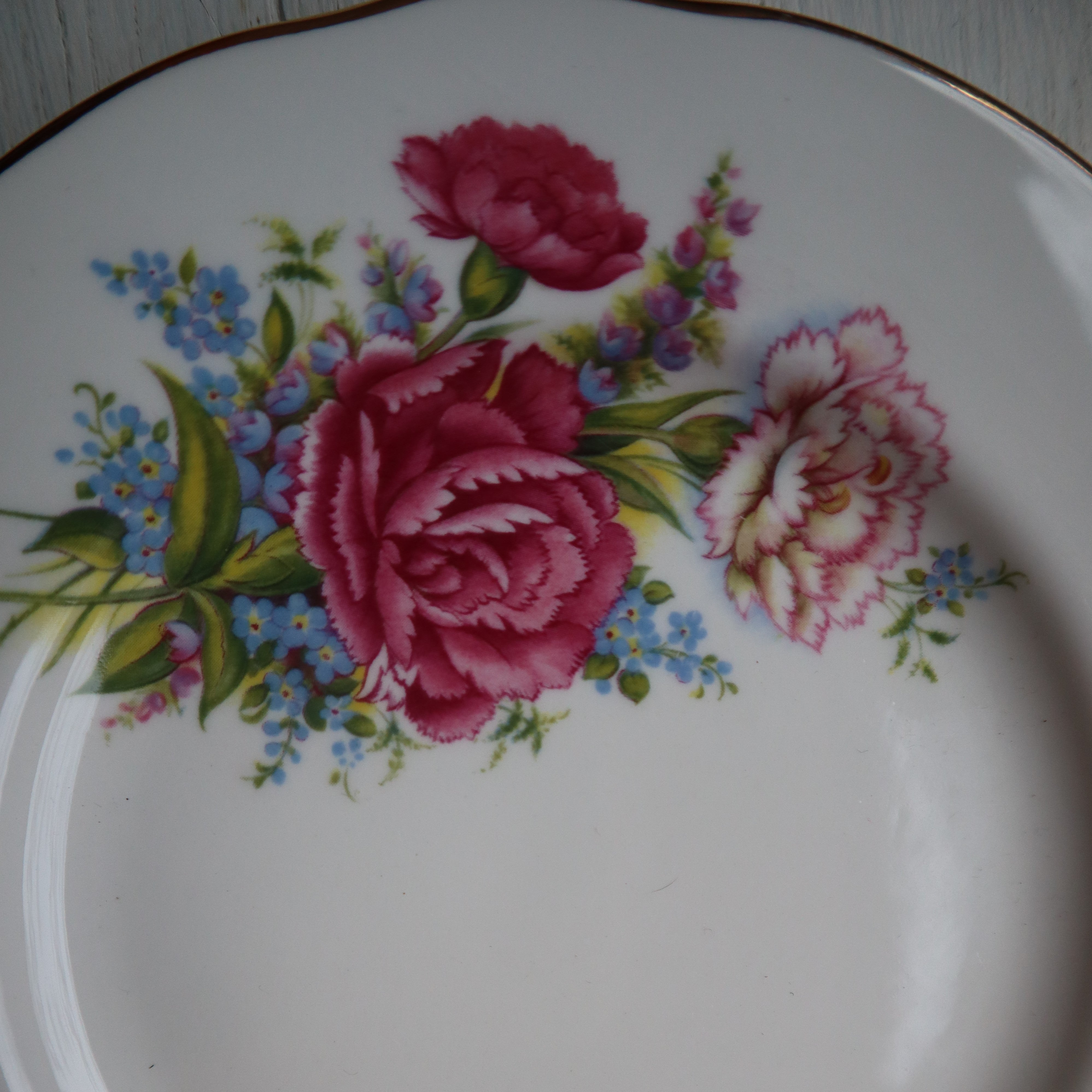 alt="vintage Duchess china plate with detail of dainty flowers. Mismatched china available from Bramble and Fox UK hygge shop