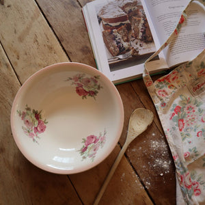 alt="james kent old foley victoria rose bowl in cosy baking scene with floral apron and cookery book. Bowl available from Bramble and Fox UK hygge homewares" 