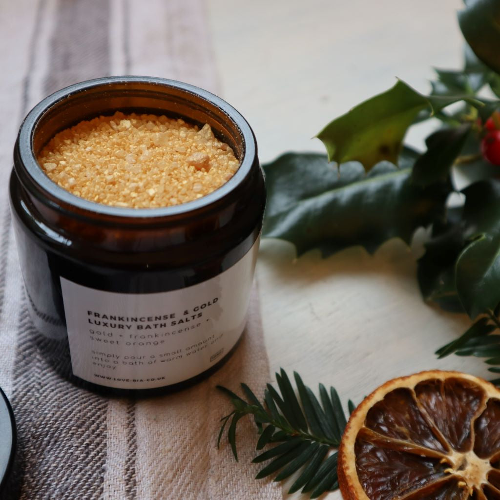 Frankincense and gold luxury bath salts, presented in an amber glass jar. A sophisticated blend of sweet orange, clove and frankincense essential oils, rich mineral salts and silky kaolin clay. Available from brambleandfoxshop.com