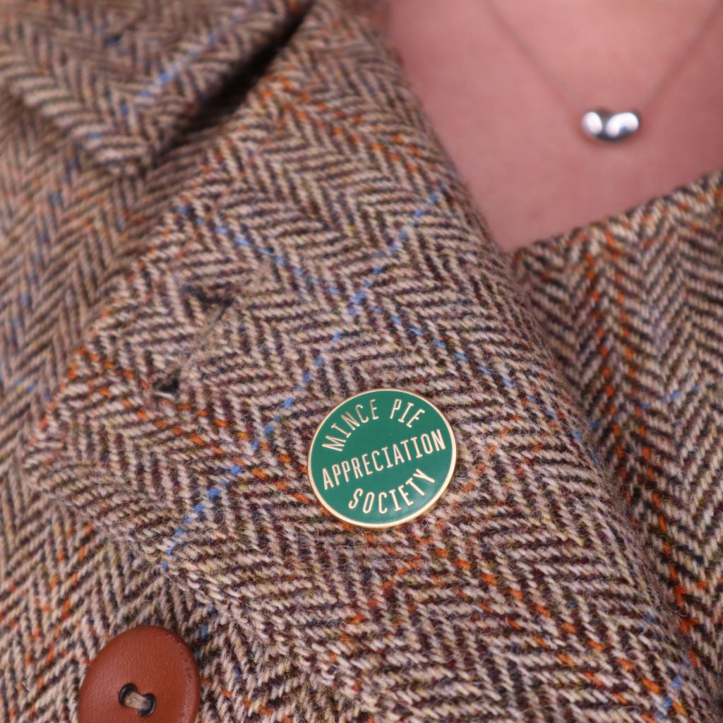 Green and gold "mince pie appreciation society" enamel pin badge. Great secret santa or stocking filler gift. Available from brambleandfoxshop.com