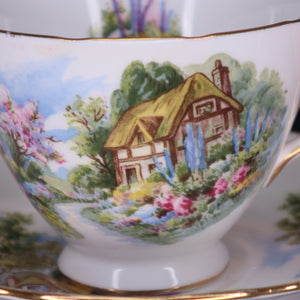 alt="Detail shot of royal vale country cottage china, featuring a thatched cottage with wildflower cottage garden. Available from Bramble and Fox UK cottagecore home and gift shop"
