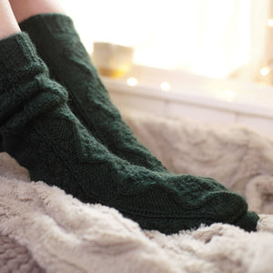 alt="forest green handknitted arran socks by Bibico. Available from Bramble and Fox UK hygge shop"