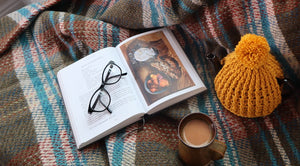 alt="earthy toned wool blanket and mustard tea cosy perfect for cosying up on autumn and winter evenings, UK hygge gifts Bramble and Fox"