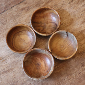alt="overhead view of 4 wooden nibble bowls with attractive graining from Bramble and Fox UK hygge homeware shop"