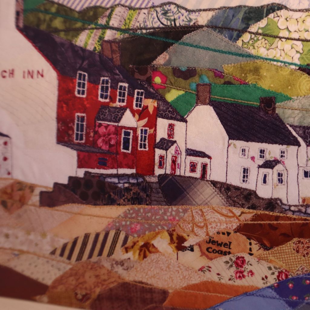 alt="close up of Ty Coch Inn patchwork textile art by Josie Russell, available from Bramble and Fox UK hygge home shop"
